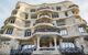 Close up of the external facade, curvy design with ornate iron balconies