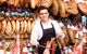 Man cutting ham at a food stall