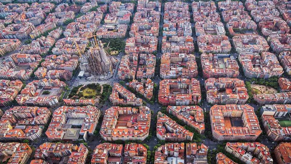 Aerial view of the Sagrada Familia standing out amid blocks and blocks of apartments