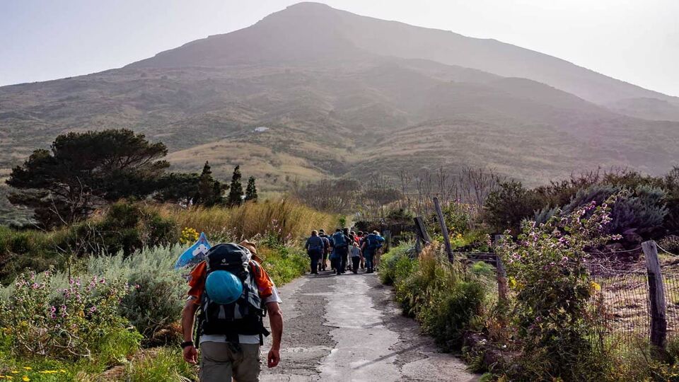A group of climbers starts climbing the Stromboli volcano, Aeolian Islands, Sicily, Italy.