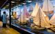 Interior display gallery showing model ships in glass cases