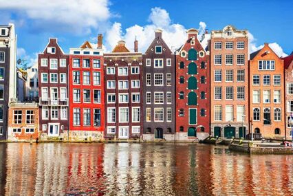 Rows of houses near a canal in daytime