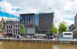 Exterior view of the Anne Frank House Museum with long queues outside