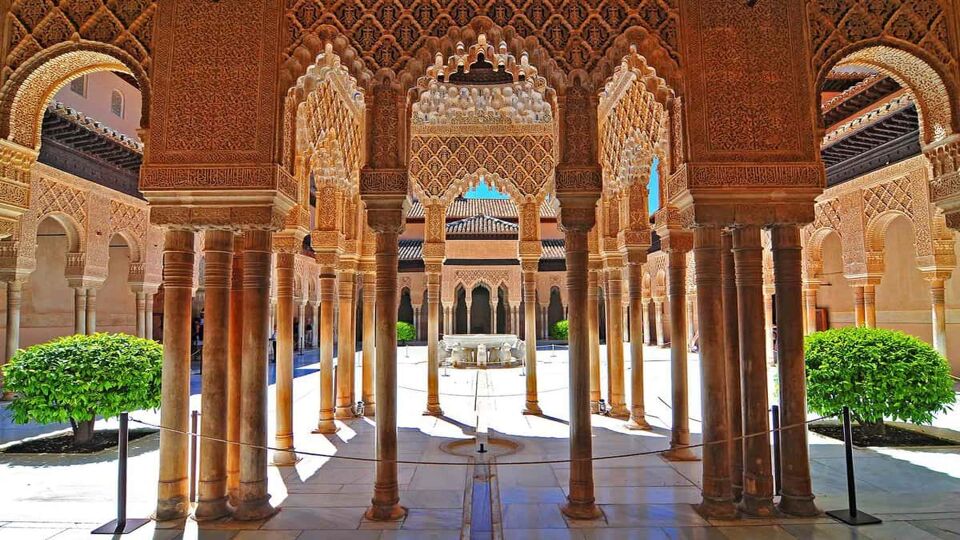 View through Mudejar style arches to a central courtyard