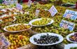 Plates of olives for sales on a stall