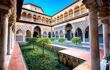 View of the stunning internal courtyard/garden, with ornate balcony surrounds in Mudejar style