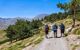 Three hikers walking in the morning on the path that leads to Mulhacen