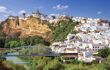 The white village cascades down the side of the hill