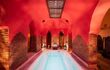 A hot water pool in a Hammam with red painted wallks