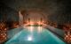 Soothingly low-lit large pool inside the Hammam