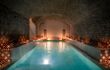Soothingly low-lit large pool inside the Hammam