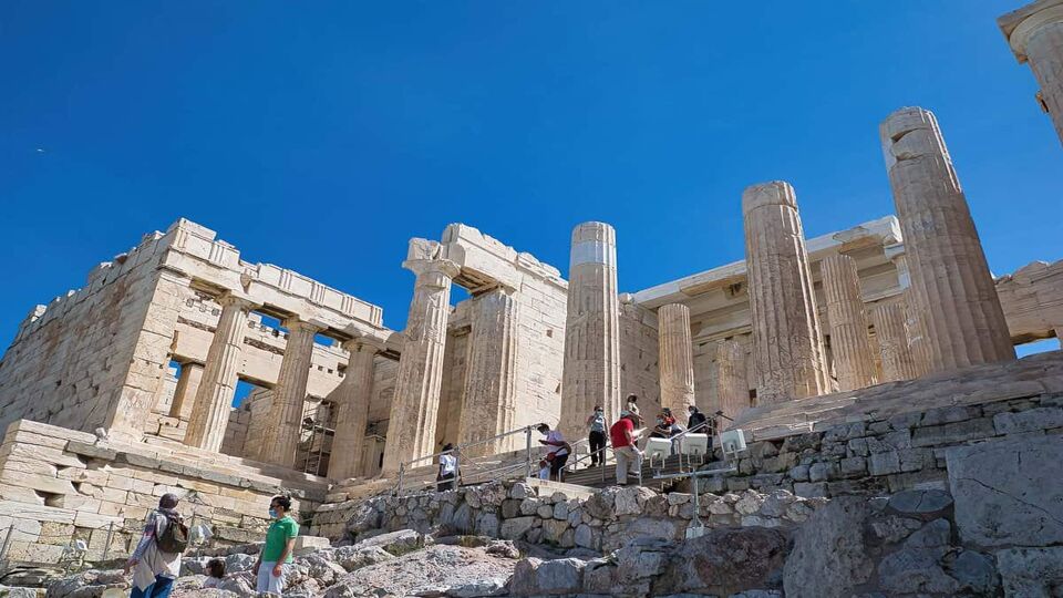 Propylaea entrance with tourists walking