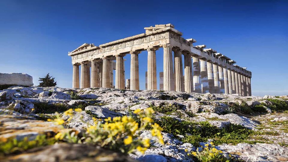 Parthenon temple with spring flowers