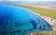 Aerial view of the wetlands of Schinias with rare pine trees and turquoise water