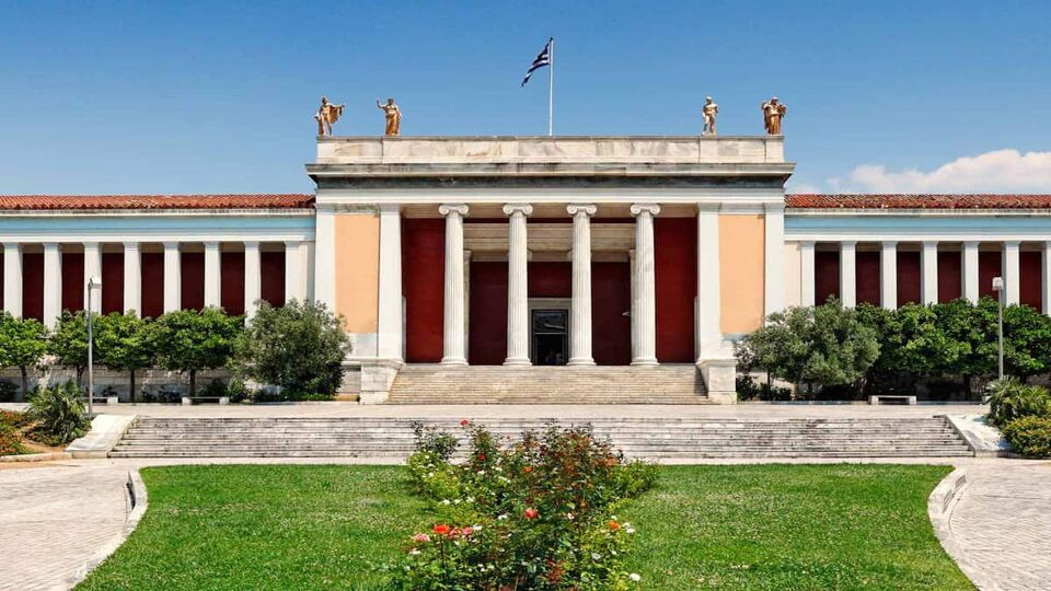 Exterior of the museum with the Greece flag flying on top of the building