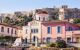 A street in Plaka with buildings painted in bright pastel colours