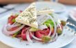 Greek salad with fresh vegetables, feta cheese and green olives