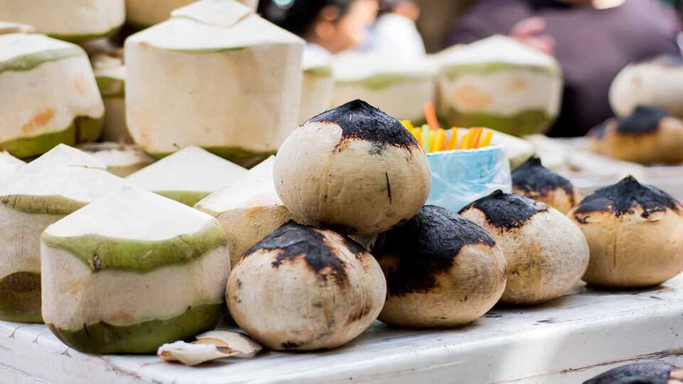 Coconut and grilled coconut in market
