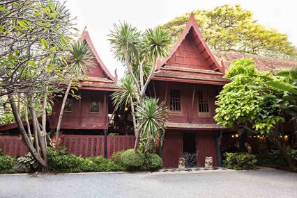 Exterior of the house, surrounded by lush greenery
