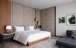 Large bedroom with wall panelling