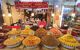 Heaped piles of food being sold on a market stall