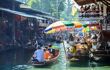 Boats filled with people on the Floating Market canal