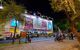 Boxing stadium at night with queues of people outside