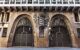 Close up of the two brown ornate entrance doors