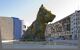 view of a giant flower-covered dog statue in a square