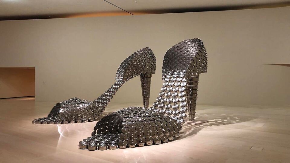 A pair of giant high heel shoes made from metal disks