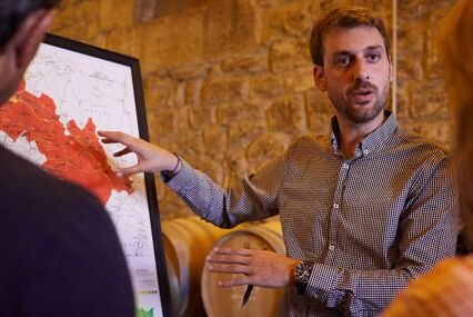 man giving a talk on wine