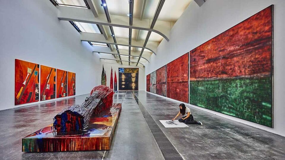 student painting inside the UCCA in the 798 Art District zone area in Beijing China