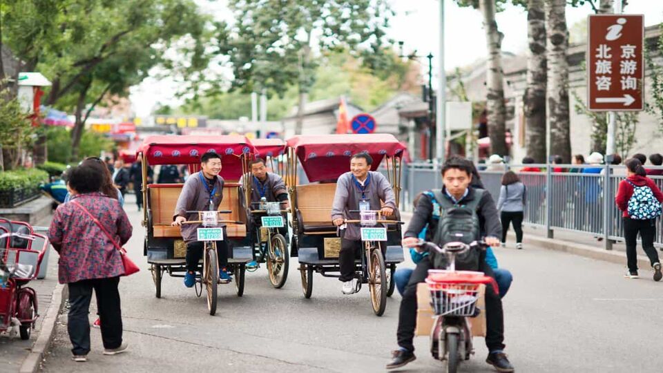 Rickshaw riders on Futong Street in Houhai Lakes