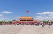 Visitors on sunny Tiananmen Square. With 440,500 m2 it is one of the world's largest squares and has great cultural significance as place of important events in Chinese history.