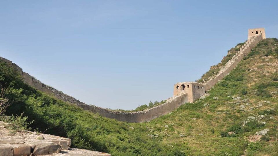 Crumbling Great Chinese Wall running down a hill, Huanghua Great Wall of  China, Great Wall