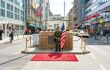 front street view of checkpoint charlie with US soldeir standing guard