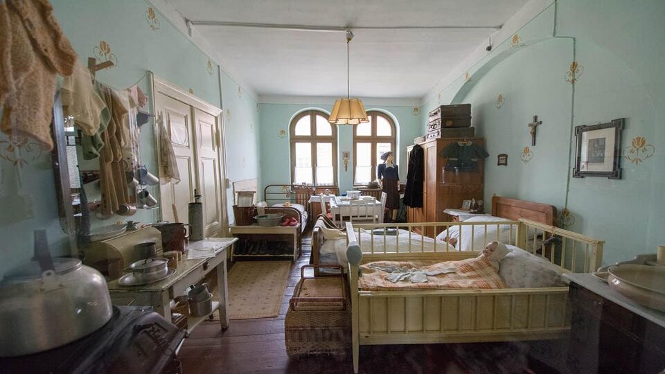 The exhibition room in DDR museum shows how poor people in East Germany decorated their apartment with all functions in one room.