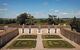 Decorative gardens in front of a Chateau Fombrauge building