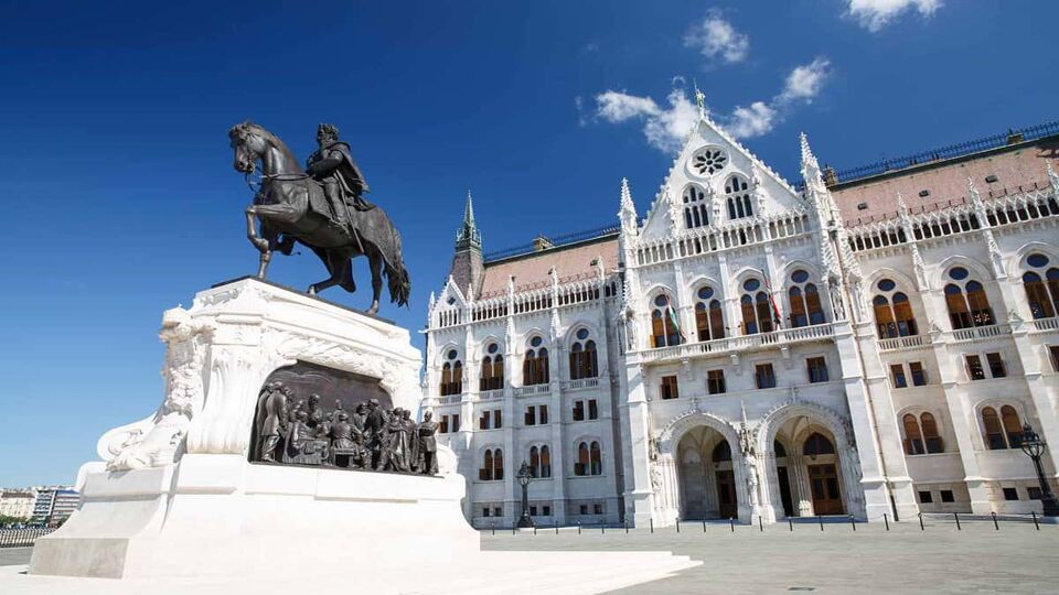 Front entrance to Hungarian Parliament with statue of St. Stephen outside