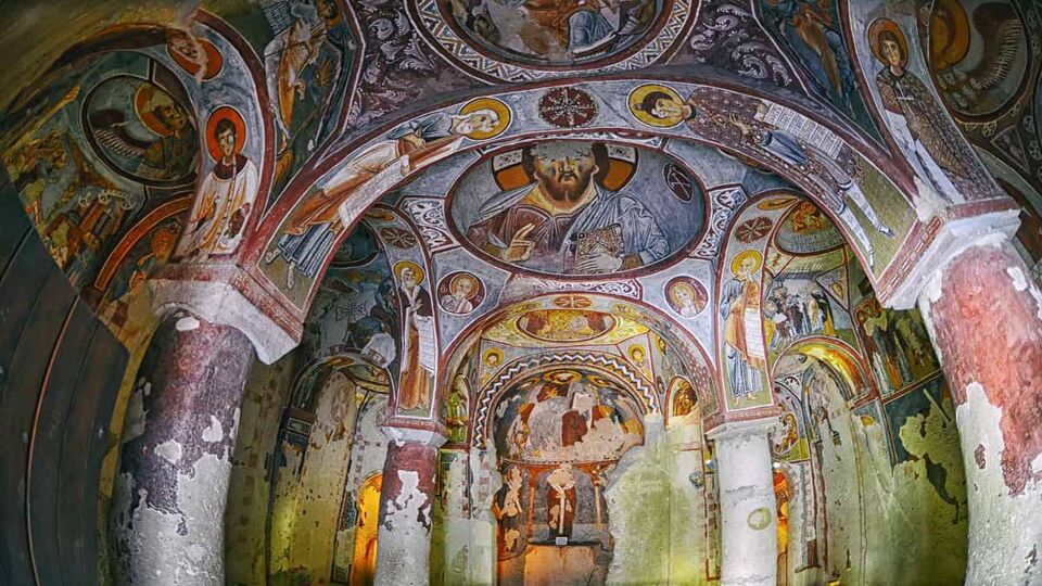 A domed, intricately painted ceiling of a church.