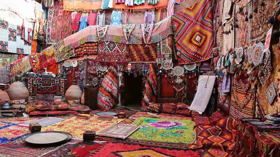 A room covered in colourful rugs..