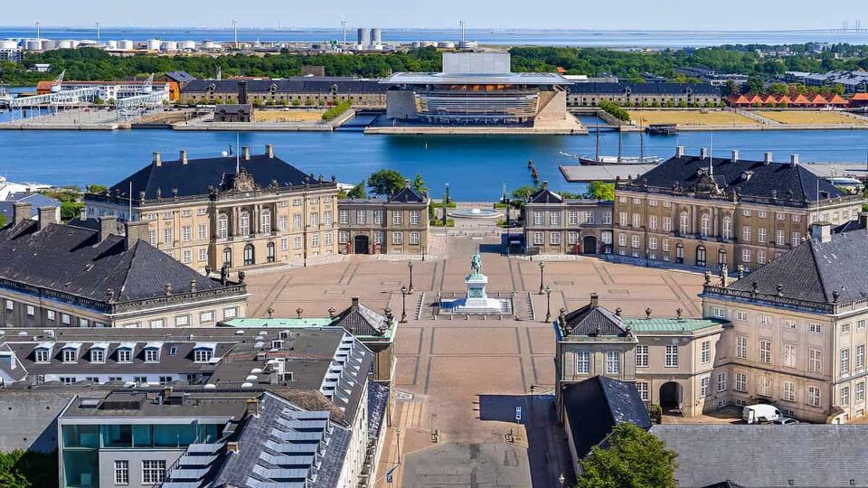 Aerial view of Amalienborg Palace in Copenhagen, Denmark. Surrounding the palace square with its statue of King Frederik V from 1771, Amalienborg is made up of four identical buildings.