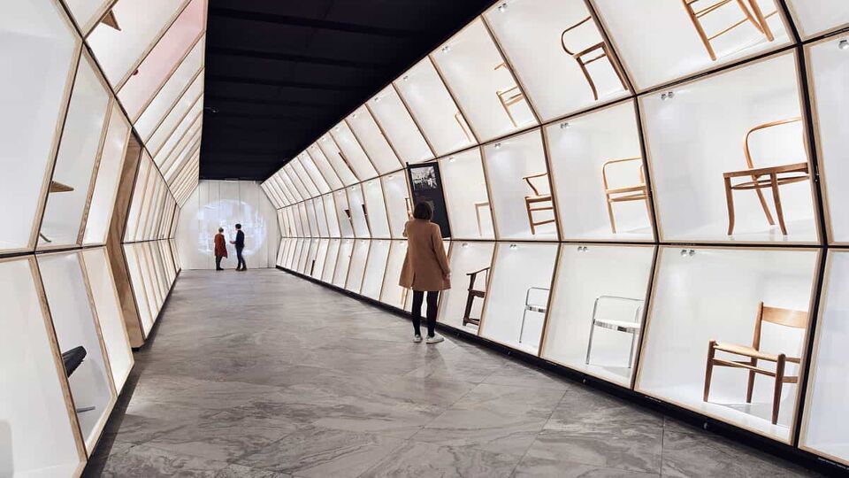corridor filled with display cases in the Design Museum Denmark