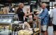 Customer buying at food stall at the Torvehallerne food market