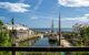 VIew of the port looking at to sea, with sailing ship in dock