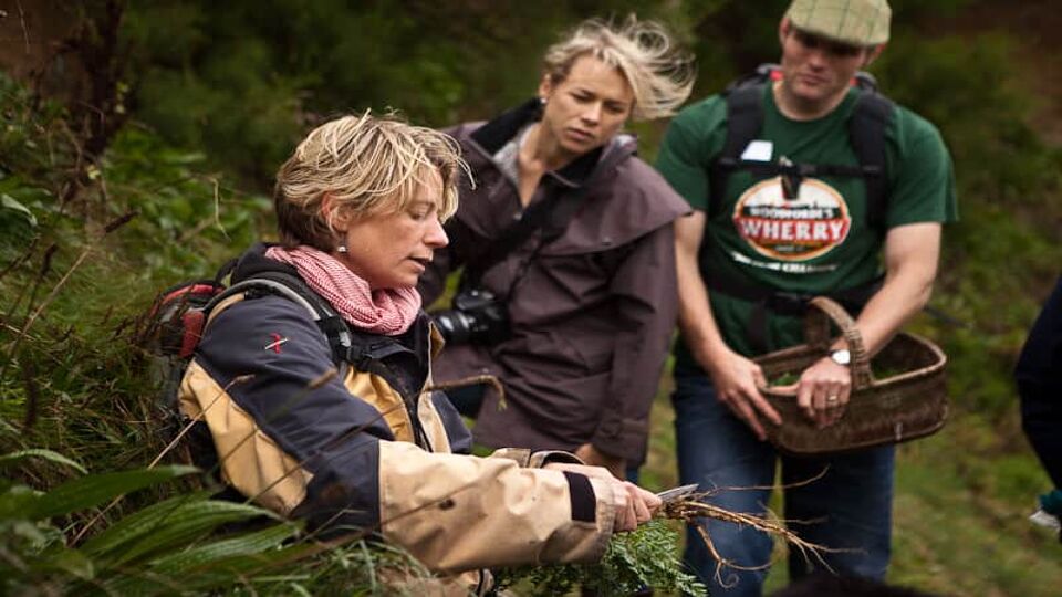 Foraging guide inspecting wild food int he woods