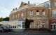 Exterior of the red brick building home to Rick Steins famous Seafood Restaurant