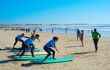 Young surfers learning to surf on Harlyn Beach