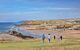 Bude, Cornwall, UK - People walking down to Summerleaze beach from Compass Point, during the summer heatwave.