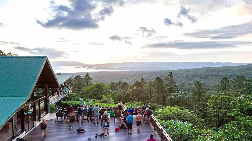 tourists and guides enjoying the sunset from the Observatory Lodge